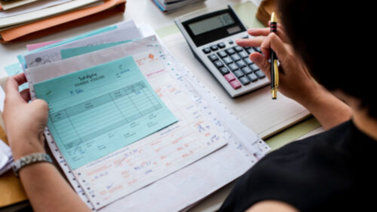 asian-woman-working-through-paperwork