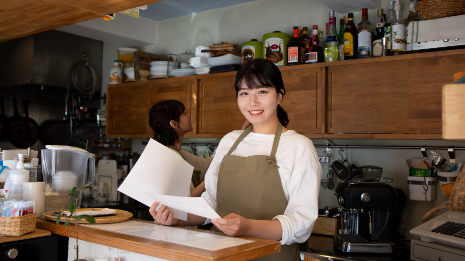 young-woman-arranging-her-cake-shop (1)