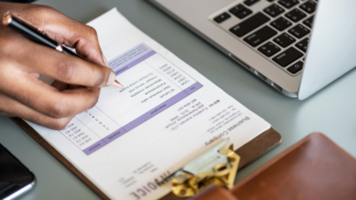 closeup-business-man-checking-tax-invoice-paper